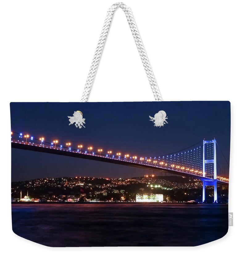 Tranquility Weekender Tote Bag featuring the photograph Bosphorus Bridge Illuminated At Night by Smartshots International