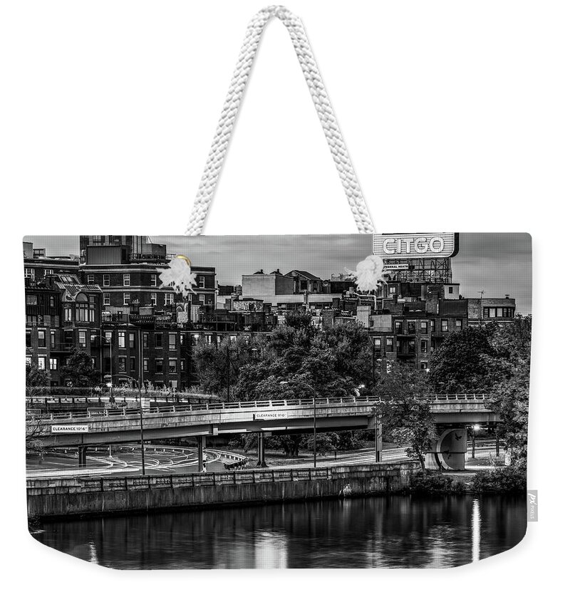 America Weekender Tote Bag featuring the photograph Boston Citgo Sign Along the Charles River - Black and White by Gregory Ballos