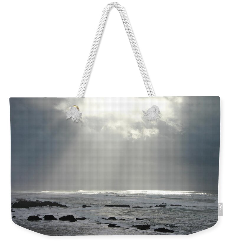Water's Edge Weekender Tote Bag featuring the photograph Break In The Clouds by Ranplett