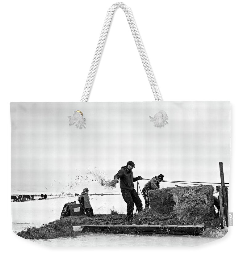 Ranch Weekender Tote Bag featuring the photograph Breaking the hay by Julieta Belmont