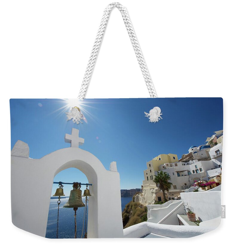 Scenics Weekender Tote Bag featuring the photograph Bright Bell Tower Santorini Greece by Peskymonkey