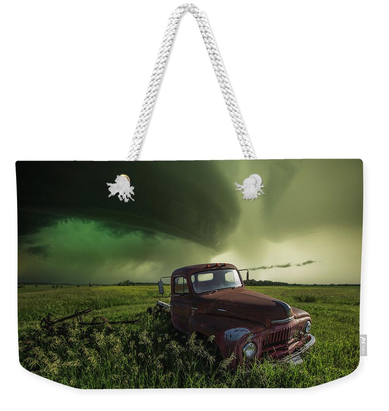 Old Truck International L 130 Pickup Rust Decay Abandoned Forgotten Shelf Cloud Hail Core Scary Dangerous Storm Thunderstorm Usa Top Best Wbpa Severe Weather Aaron Groen Storm Chase Grass Canon Rain Hail Warned Weekender Tote Bag featuring the photograph Broke by Aaron J Groen