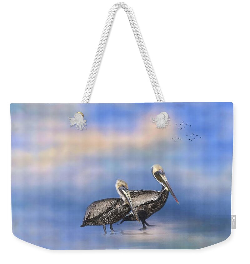 Pelican Weekender Tote Bag featuring the photograph Brown Pelicans at the Shore by Kim Hojnacki