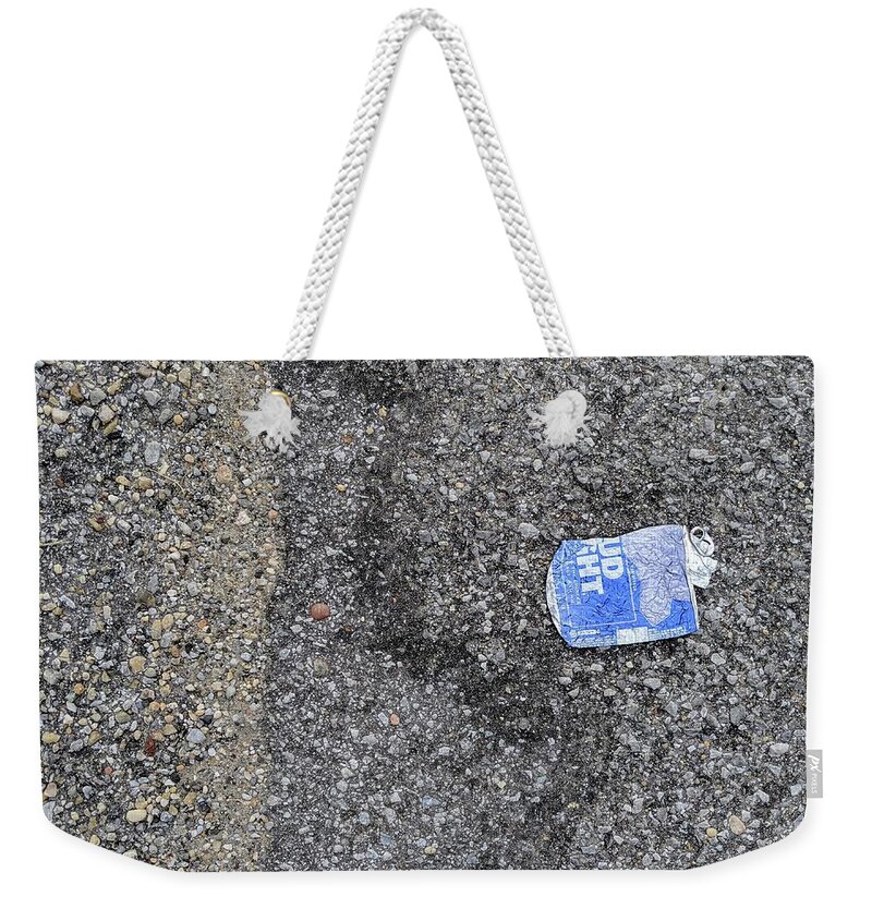 Budlitter Weekender Tote Bag featuring the photograph #BudLitter and Two Types of Asphalt Aggregate by Jeremy Butler
