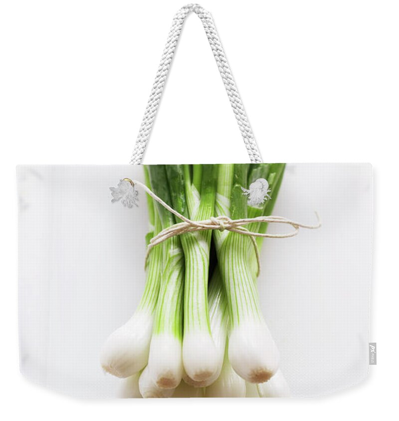 White Background Weekender Tote Bag featuring the photograph Bunch Of Spring Onions On White by Martin Poole