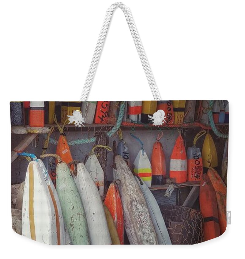 Buoys Weekender Tote Bag featuring the photograph Buoys in a sea shack by Mary Capriole