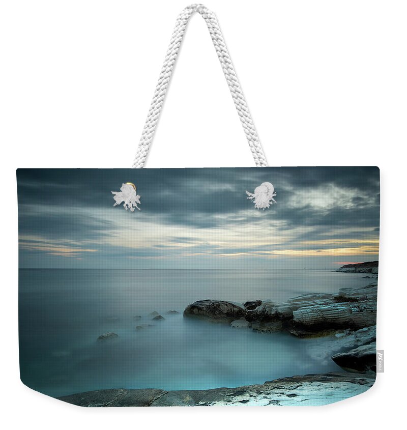 Seashore Weekender Tote Bag featuring the photograph Calmness of the sea by Michalakis Ppalis