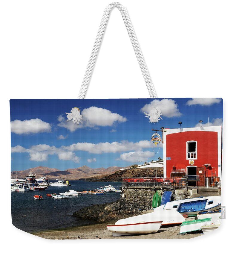 Motorboat Weekender Tote Bag featuring the photograph Canary Islands, Lanzarote, Puerto Del by Wilfried Krecichwost