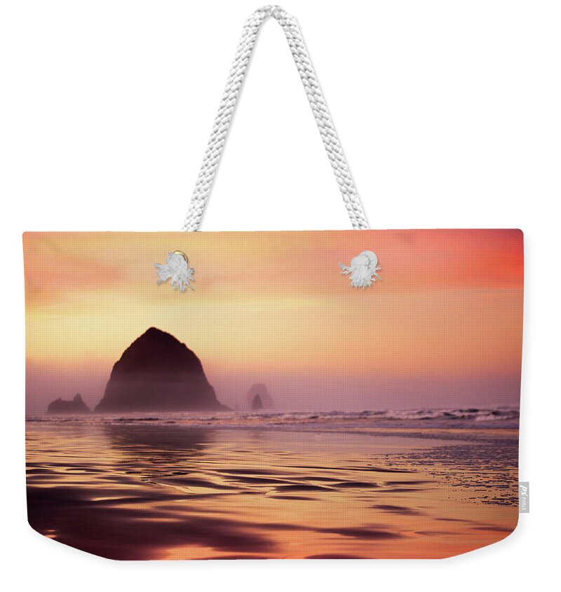 Dawn Weekender Tote Bag featuring the photograph Cannon Beach Haystack Rock by Ryanjlane