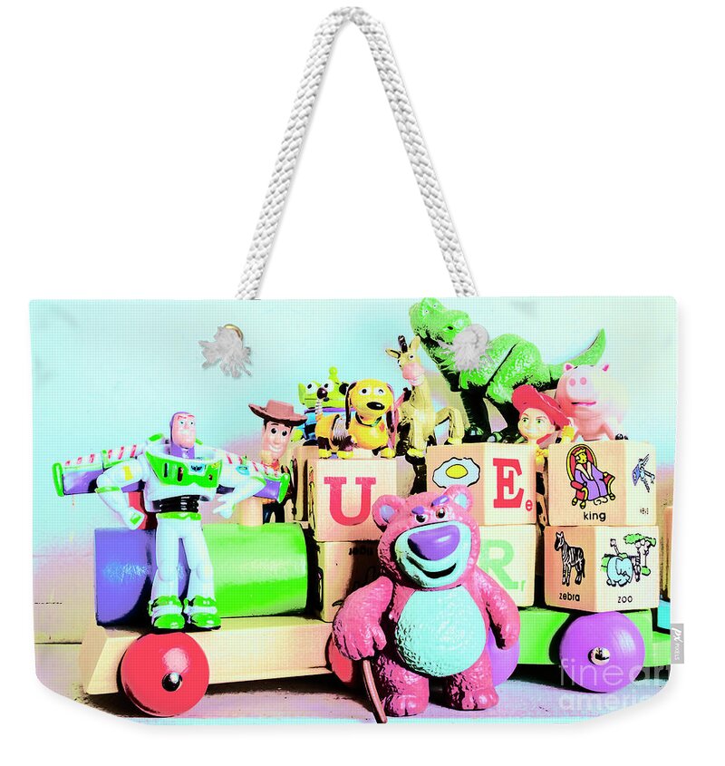 Toy Weekender Tote Bag featuring the photograph Carriage of cartoon characters by Jorgo Photography