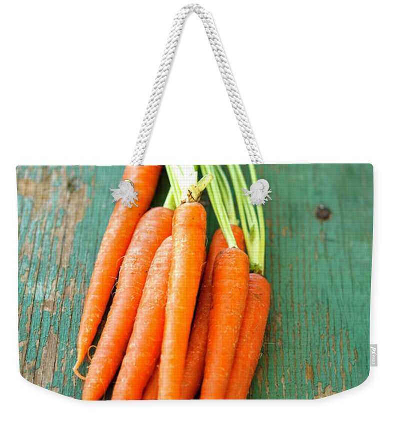 Juicy Weekender Tote Bag featuring the photograph Carrots by Thepalmer