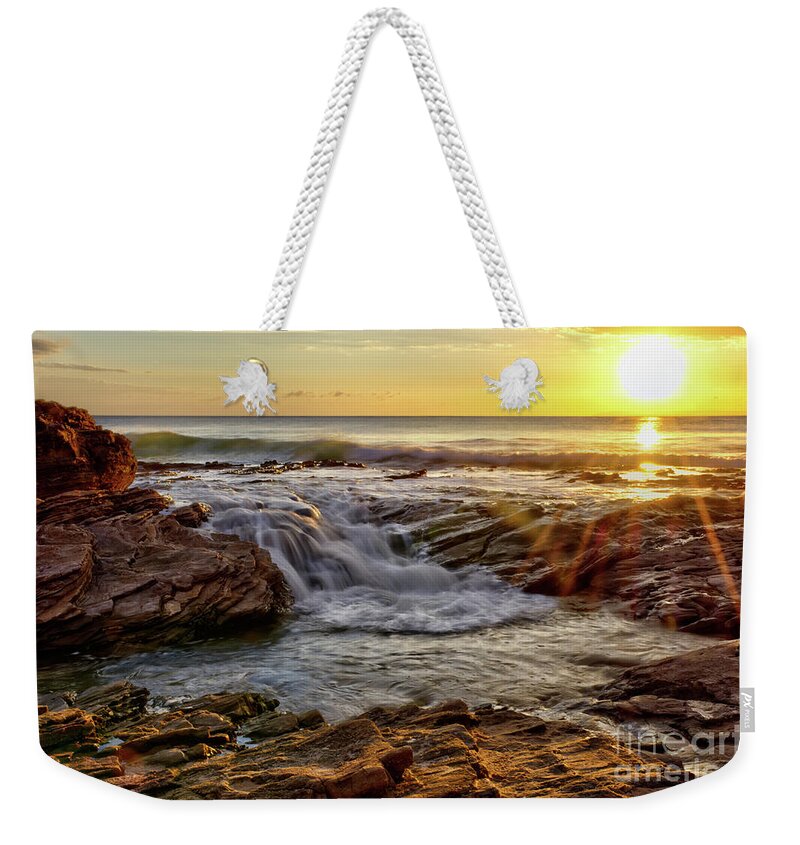 Cascading Weekender Tote Bag featuring the photograph Cascading Sunset at Crystal Cove by Eddie Yerkish