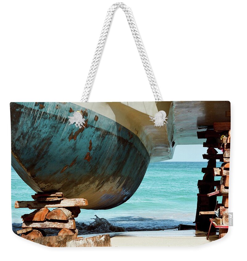 Freight Transportation Weekender Tote Bag featuring the photograph Catamaran Repair On Beach In Jamaica by Joseph X. Burke Analog Photography