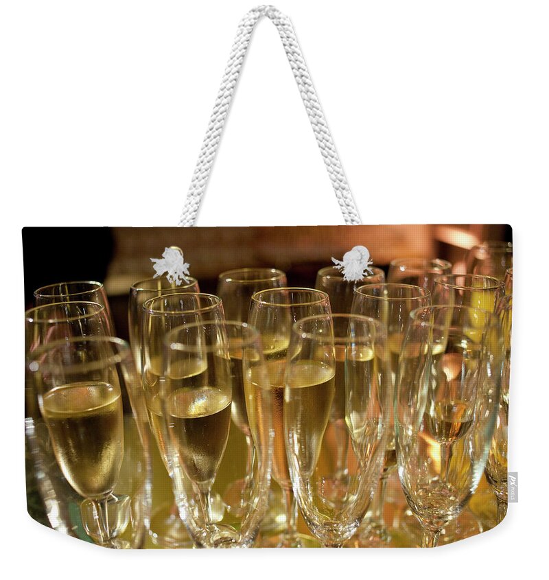 Celebration Weekender Tote Bag featuring the photograph Champagne At A Gala Event by Owen Franken