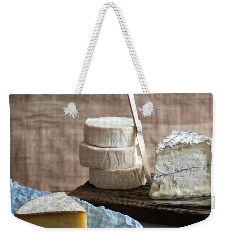 Cheese Weekender Tote Bag featuring the photograph Cheeses by Melina Hammer