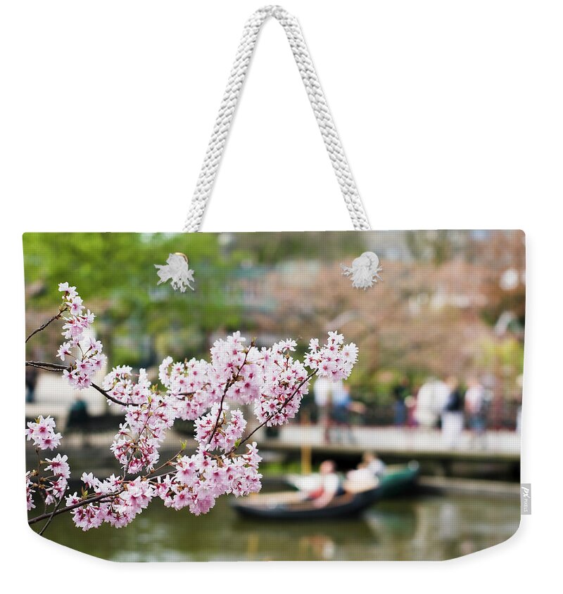 Copenhagen Weekender Tote Bag featuring the photograph Cherry Tree Flowers In Tivoli Gardens by Suzanaprofeta