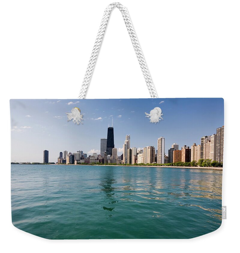 Lake Michigan Weekender Tote Bag featuring the photograph Chicago Skyline From The Lake by Stevegeer