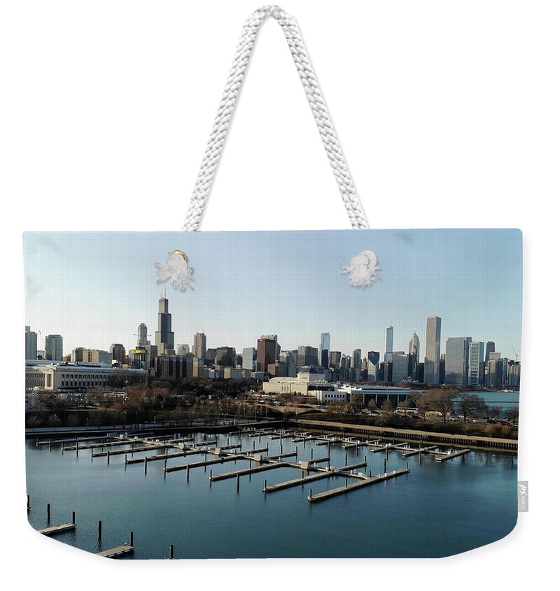 Chicago Weekender Tote Bag featuring the photograph Chicago Skyline Over Burnham Harbor by Bobby K