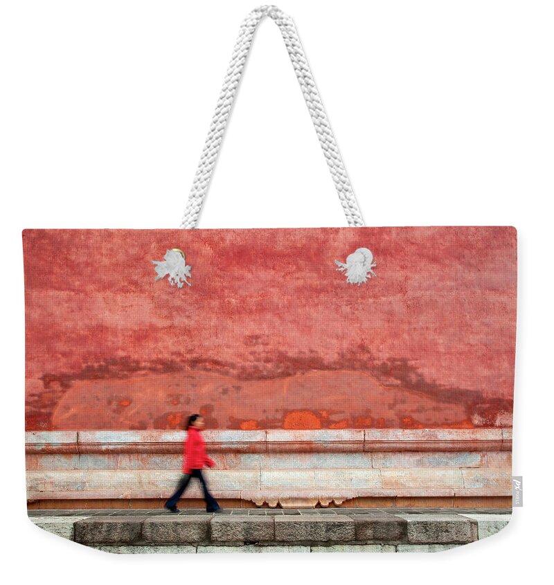 People Weekender Tote Bag featuring the photograph Chinese Young Lady Walking By Monument by Grant Faint