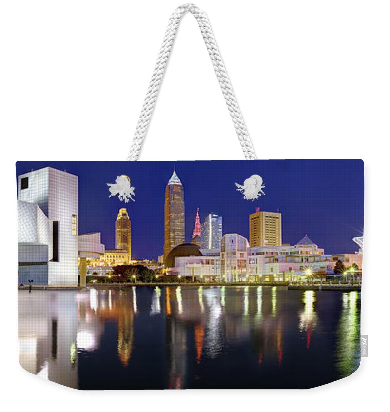 Cleveland Skyline Weekender Tote Bag featuring the photograph Cleveland Skyline at Dusk Rock Roll Hall Fame by Jon Holiday