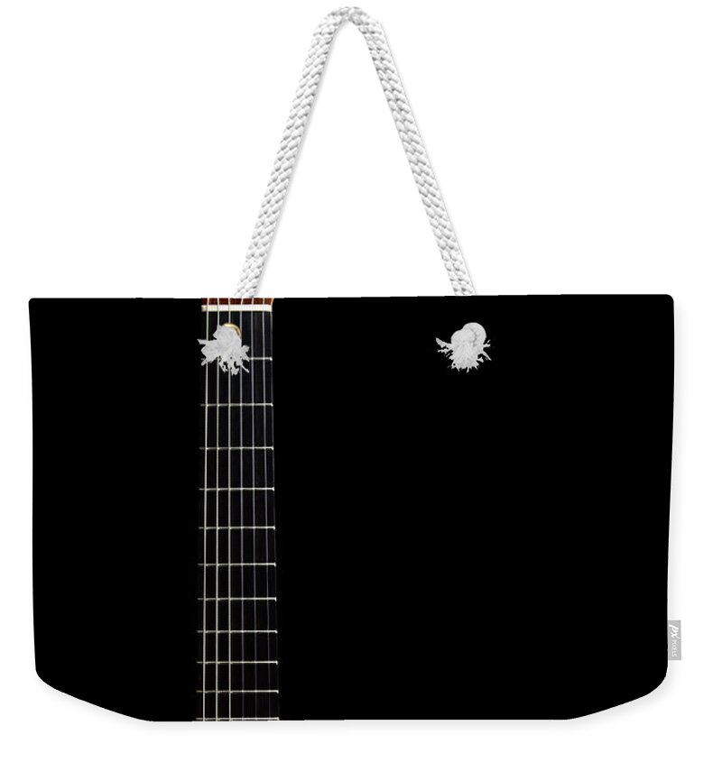 Music Weekender Tote Bag featuring the photograph Close-up Of Acoustic Guitar On Black by Sabine Scheckel
