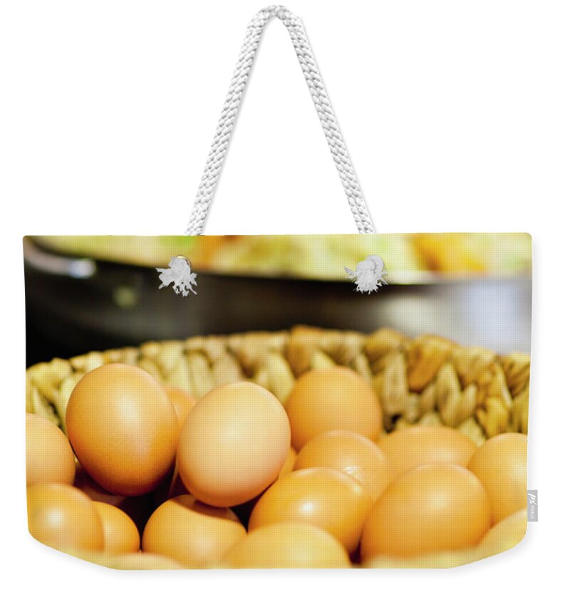 Large Group Of Objects Weekender Tote Bag featuring the photograph Close Up Of Basket Of Eggs by Hybrid Images