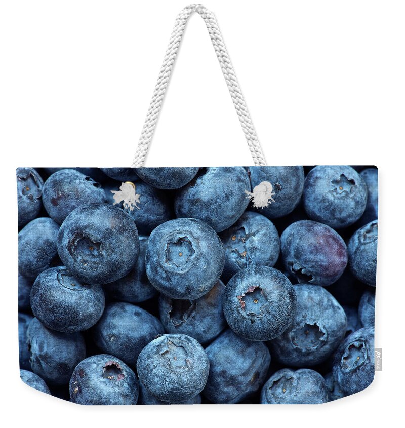 Large Group Of Objects Weekender Tote Bag featuring the photograph Close Up Of Bunch Of Blueberries by Ross Woodhall