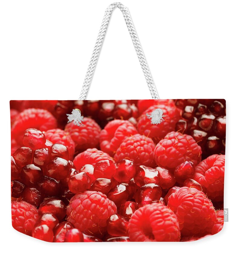Vitamin Weekender Tote Bag featuring the photograph Close Up Of Fresh Raspberries And by Andrew Bret Wallis