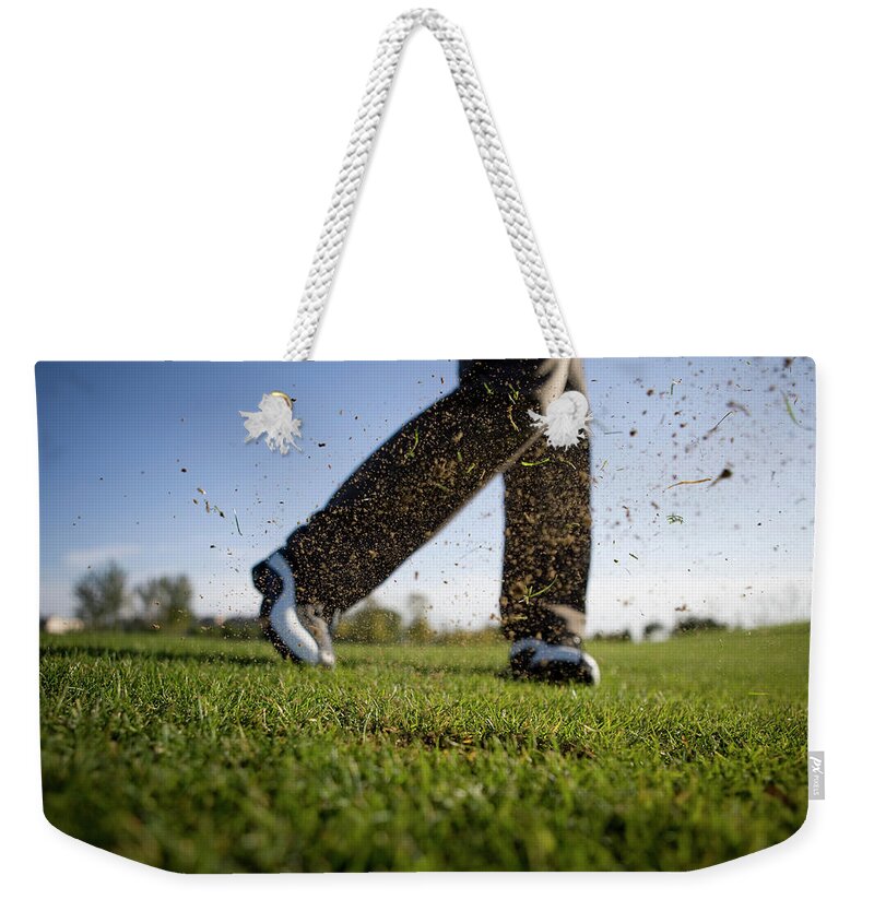 Young Men Weekender Tote Bag featuring the photograph Close-up Of Golfers Swing by Lane Oatey