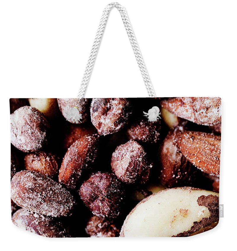 Nut Weekender Tote Bag featuring the photograph Close Up Of Salted Nuts by Line Klein