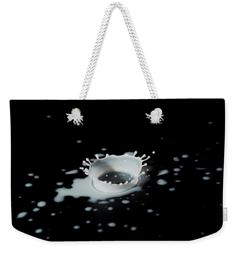 Natural Pattern Weekender Tote Bag featuring the photograph Close Up Of Splashing Drop Of Milk by Photostock-israel