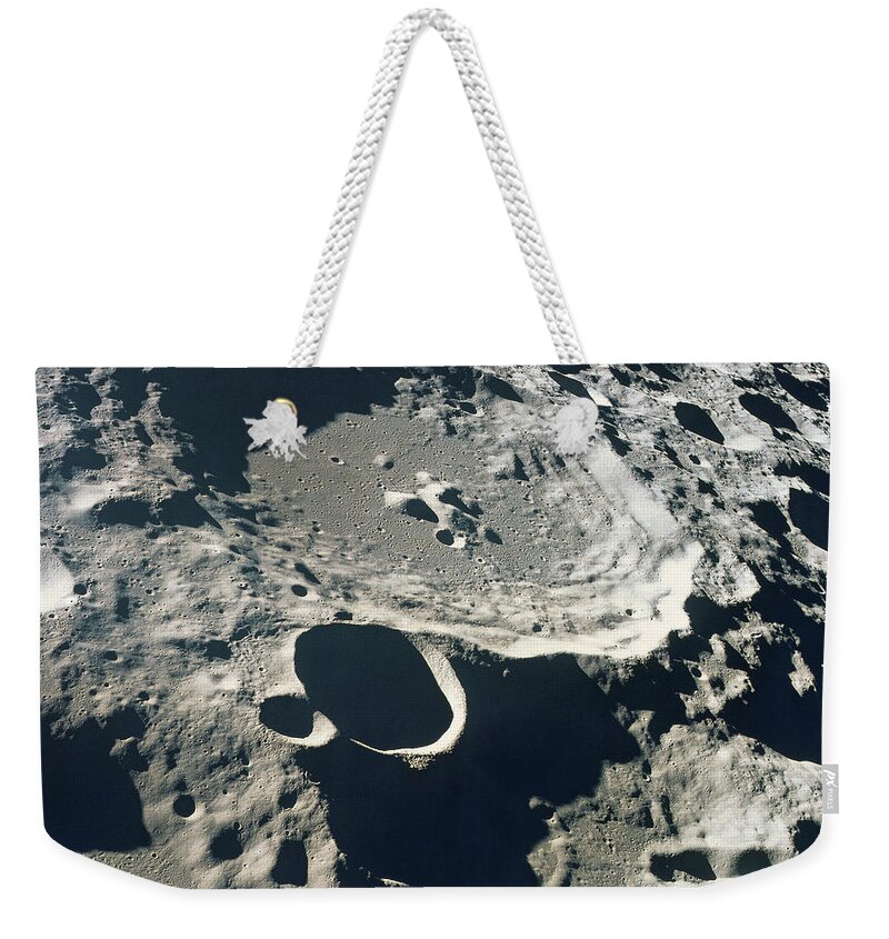 Globe Weekender Tote Bag featuring the photograph Close-up Of The Surface Of The Moon by Stockbyte