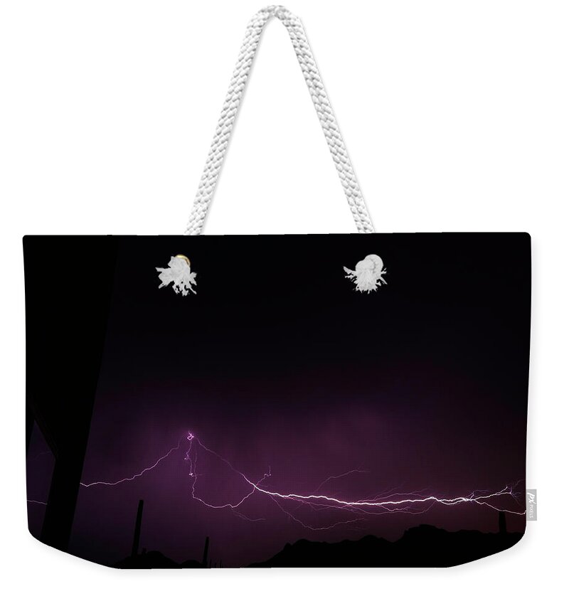 Cloud Weekender Tote Bag featuring the photograph Cloud To Cloud by Mike Herdering