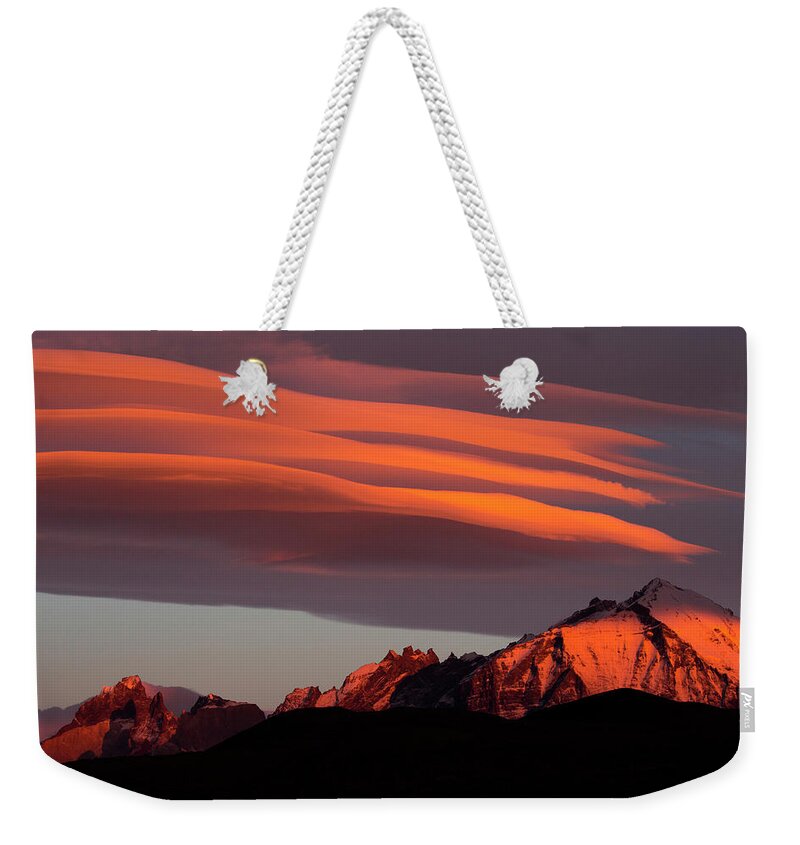 Sebastian Kennerknecht Weekender Tote Bag featuring the photograph Clouds At Sunrise Over Torres Del Paine by Sebastian Kennerknecht