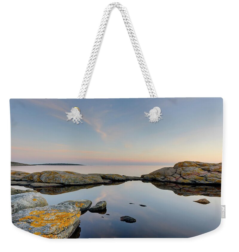 Tranquility Weekender Tote Bag featuring the photograph Coastline At Sunset by Johner Images