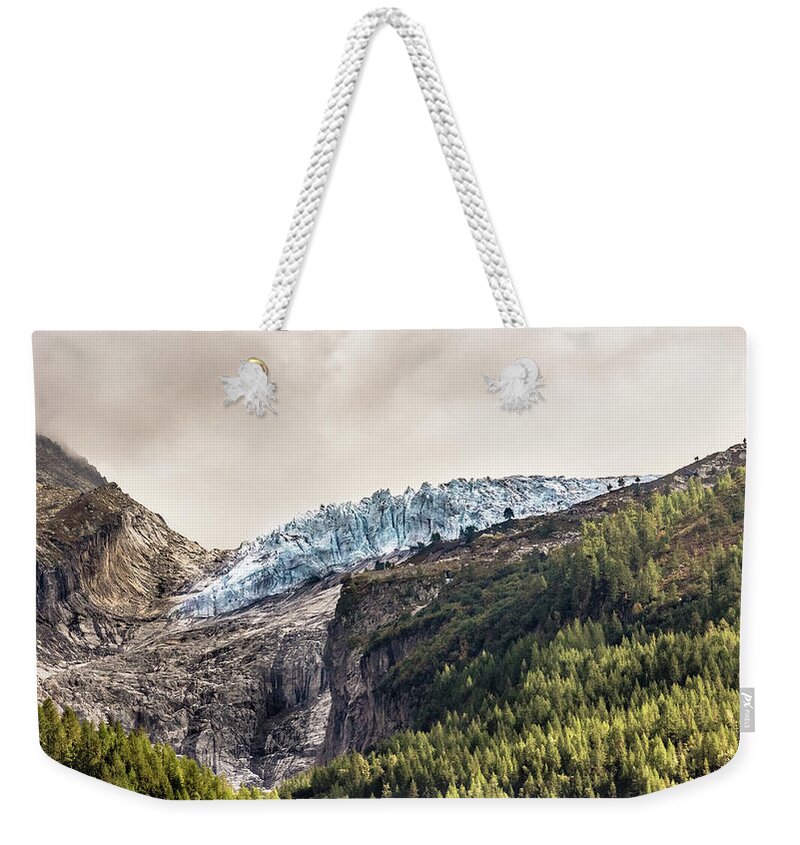 Glacier Weekender Tote Bag featuring the photograph Cold Heart of the Mountain by Pavel Melnikov