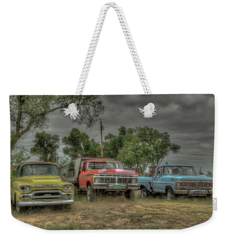 Clouds Weekender Tote Bag featuring the photograph Colorful Cars by Laura Hedien