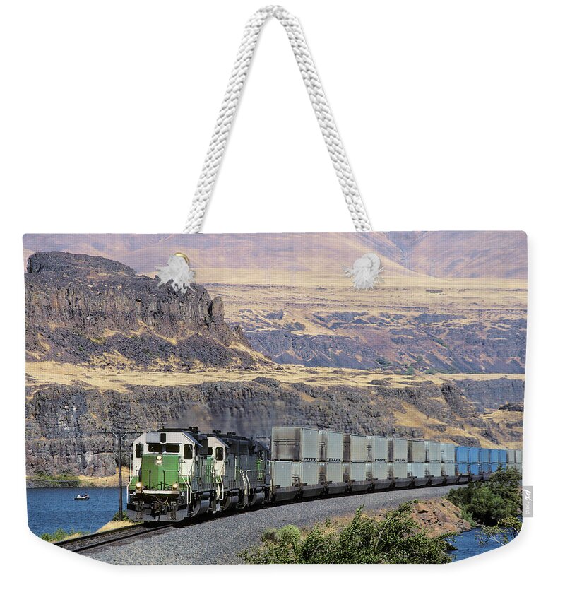 Scenics Weekender Tote Bag featuring the photograph Container Trash Train In Columbia River by Beyondimages