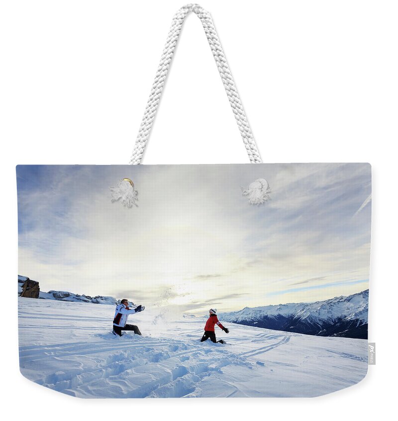 Skiing Weekender Tote Bag featuring the photograph Couple At The Top Of A Mountain by Ultramarinfoto