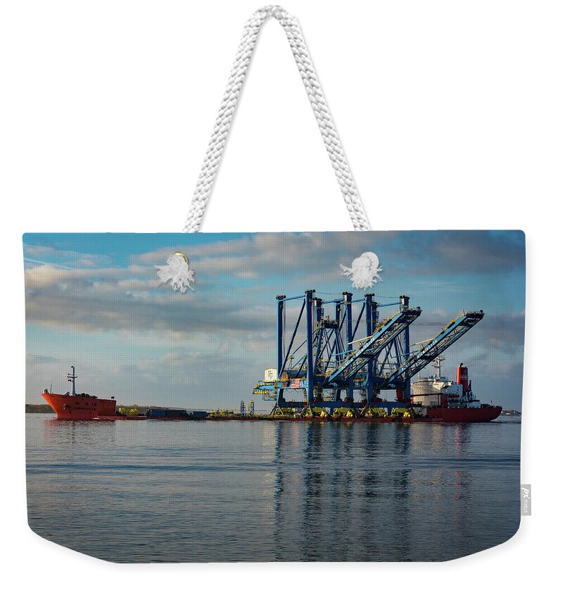 Southport Weekender Tote Bag featuring the photograph Cranes head to Wilmington. by Nick Noble