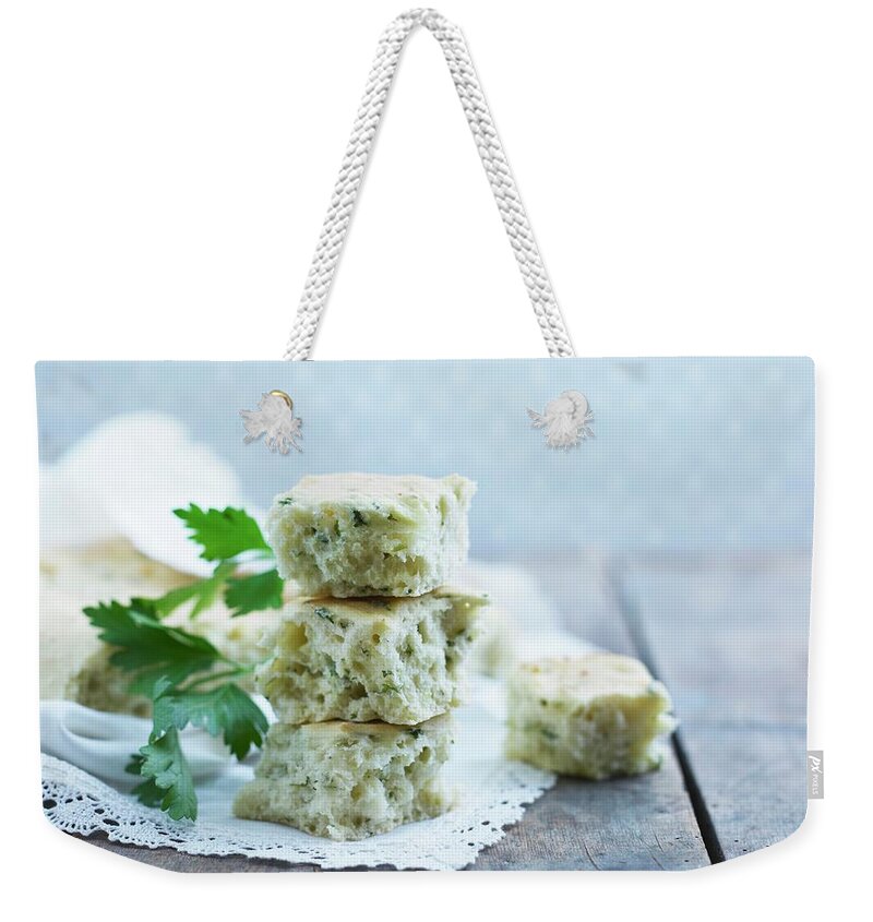 Ip_11336534 Weekender Tote Bag featuring the photograph Cubes Of Ciabatta Bread With Herbs by Mikkel Adsbl