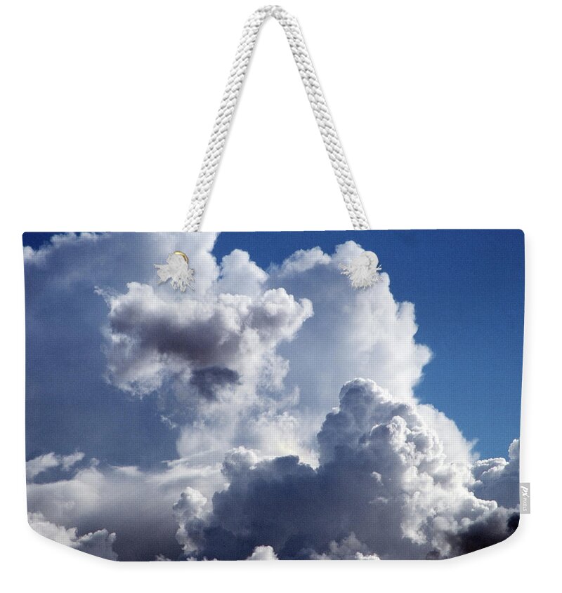 Scenics Weekender Tote Bag featuring the photograph Cumulus Clouds Against Blue Sky by Andrew Holt