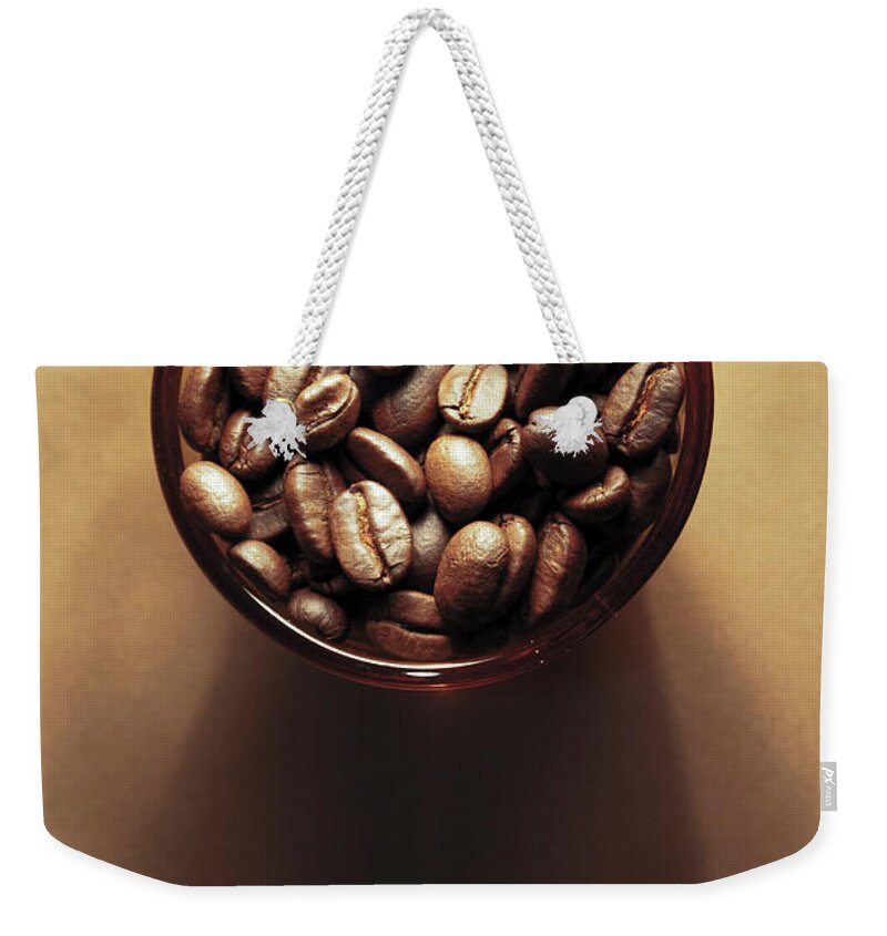 Shadow Weekender Tote Bag featuring the photograph Cup Of Coffee Beans by Dhammika Heenpella / Images Of Sri Lanka