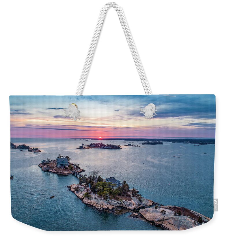 Thimble Islands Weekender Tote Bag featuring the photograph Cut in Two Sunset by Veterans Aerial Media LLC