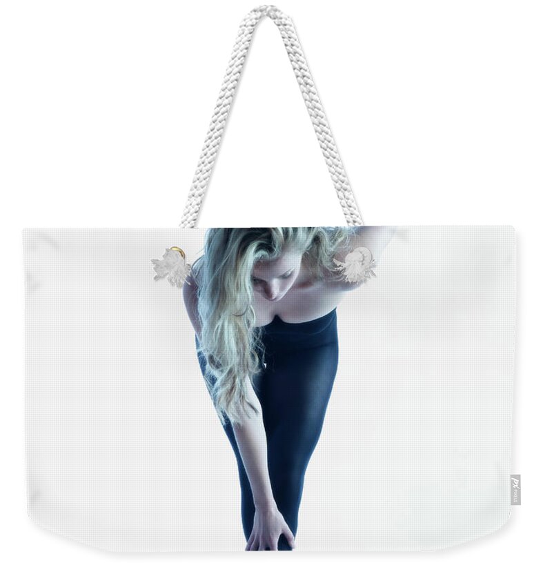 Ballet Dancer Weekender Tote Bag featuring the photograph Dancer Stretching Legs by Colin Anderson