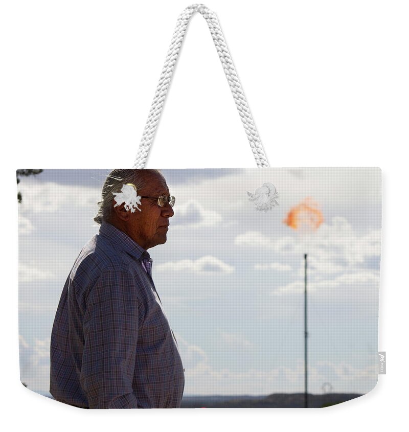 Oil Development Weekender Tote Bag featuring the photograph Daniel and the Flare by Jonathan Thompson