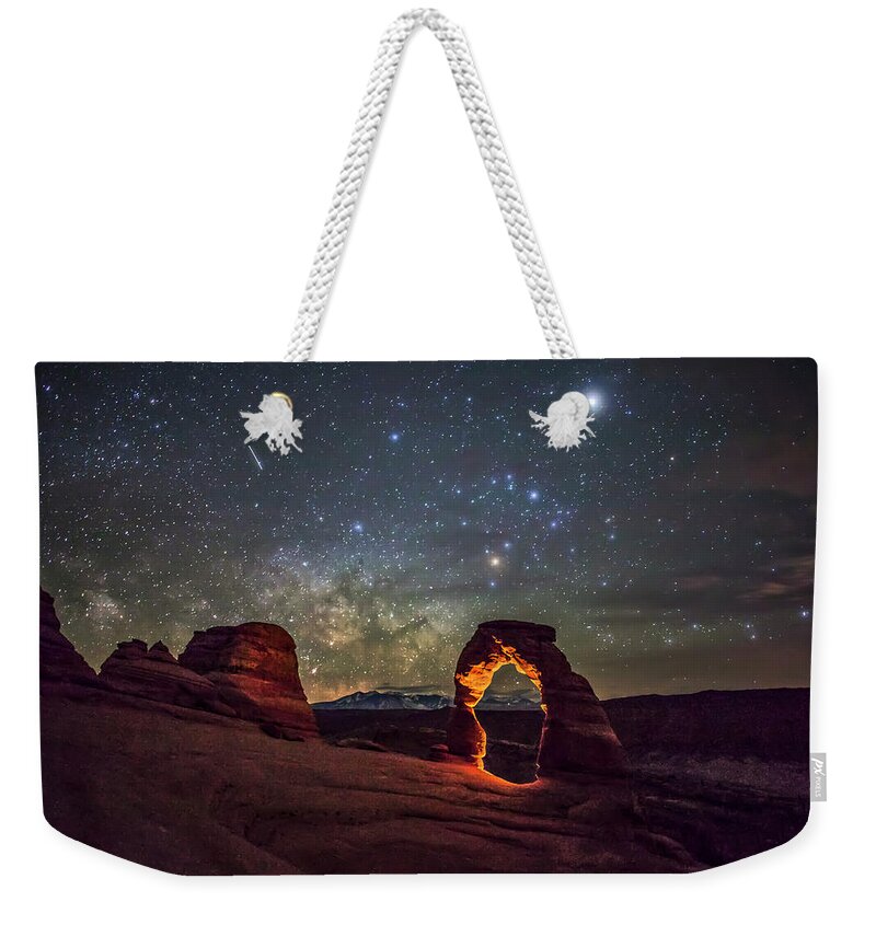 Arches National Park Weekender Tote Bag featuring the photograph Delicate Arch and the Milky Way by Dan Norris