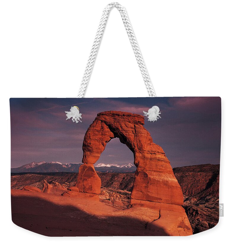 Scenics Weekender Tote Bag featuring the photograph Delicate Arch In Arches National Park by Comstock