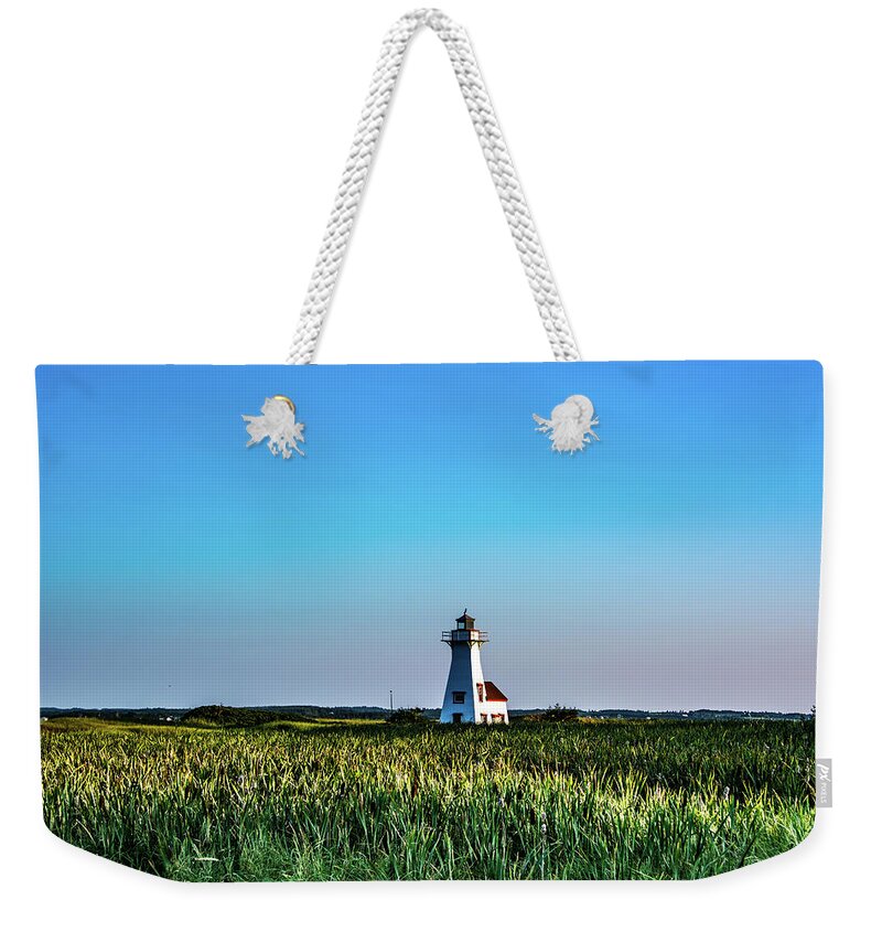 New London Weekender Tote Bag featuring the photograph Distant New London Lighhouse by Douglas Wielfaert