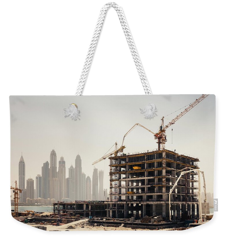 Working Weekender Tote Bag featuring the photograph Dubai Construction by Borchee